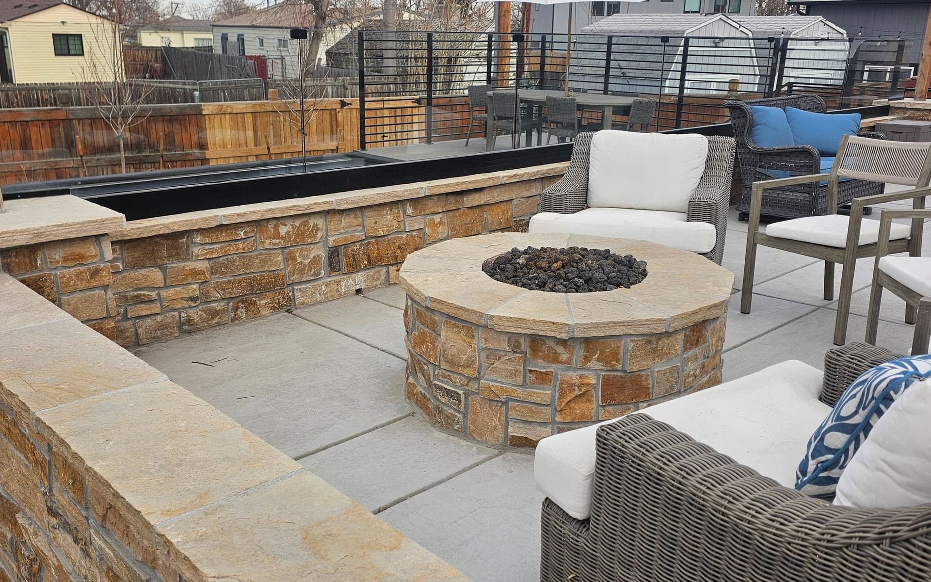Paver patio, fire pit and water feature built by Angel's Landscaping in Colorado
