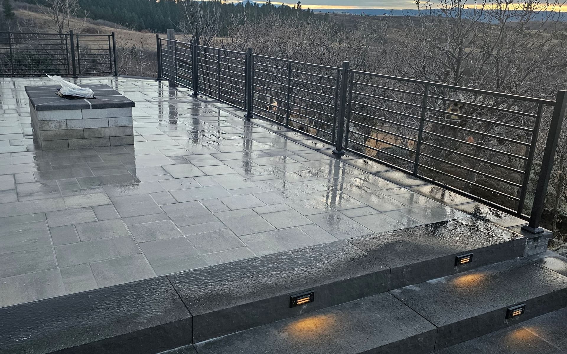 Paver patio, step lighting and fire feature built by Angel's Landscaping in Castle Rock, CO